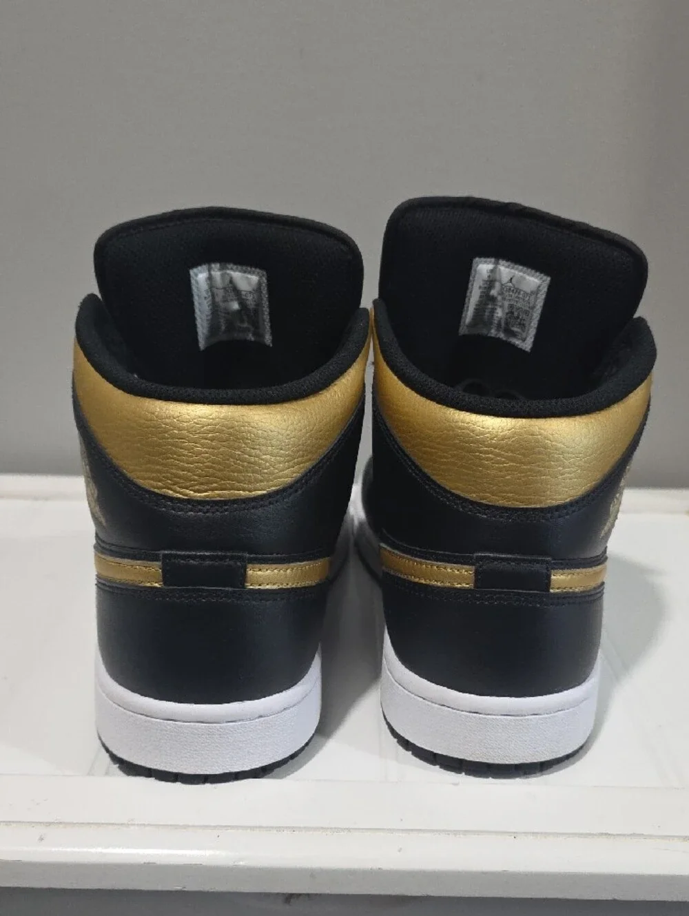 Jordan High-Top Sneakers in Black and Gold. Men's Size 9